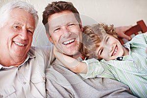 Portrait, hug and kid with father, grandfather and laughter in a house with care, trust and support. Happy family