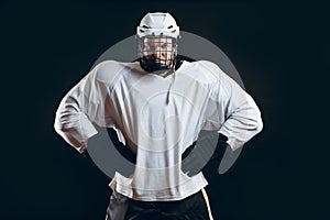 Portrait of ice-hockey player with hockey stick