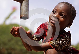 Portrait Image of African Black Girl Drinking Safe Clean Freshwater from Tap Water for Africa