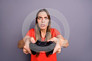 Portrait of impressed worried girl play video game dont want lose feel focused wear good looking clothing isolated over