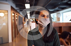 Portrait of Indian businesswoman wearing face mask in office