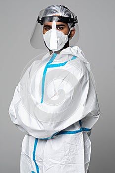 Portrait of indian man doctor in protective clothes during coronavirus pandemic. Epidemic, pandemic of coronavirus covid 19.