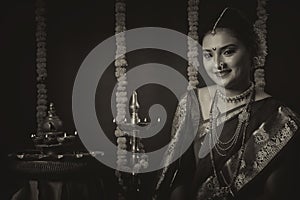 Portrait of Indian Woman celebrating Diwali festival by Lighting the lamp