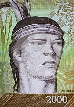Portrait of indigenous tribe chief Cacique Guaicaipuro on Venezuela 2000 Bolivar currency banknote (focus on center photo
