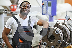 Portrait of industrial engineer. factory worker standing in factory production line