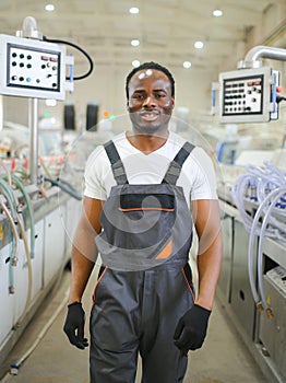 Portrait of industrial engineer. factory worker standing in factory production line