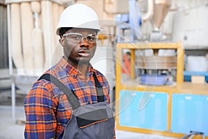 Portrait of industrial engineer. factory worker standing in factory production line