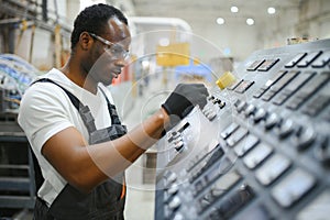 Portrait of industrial engineer. factory worker standing in factory production line