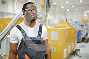 Portrait of industrial engineer. factory worker standing in factory production line