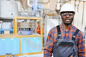 Portrait of industrial engineer. factory worker standing in factory production line