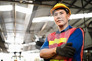 Portrait of industrial worker standing with tablet holding in her hand feeling proud and confident looking for the new opportunity