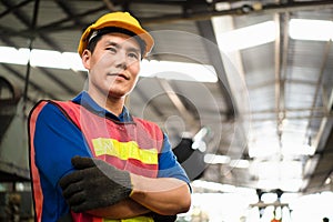 Portrait of industrial worker standing with tablet holding in her hand feeling proud and confident looking for the new opportunity