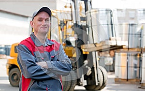 Portrait industrial worker on warehouse forklift truck background