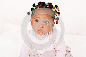 Portrait of an infant girl looking at the camera. photo