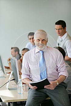 Portrait of an instructor in a classroom