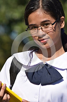 Portrait Of An Intelligent Diverse Girl Student Wearing Glasses