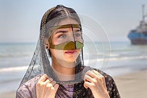 Portrait of an Iranian girl in traditional dress southern Iran.