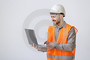 portrait isolated friendly architect with laptop on white background