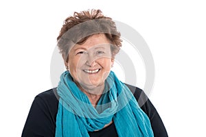Portrait: Isolated happy pensioner woman wearing blue and turquoise clothes.