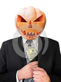 Portrait of Jack Lantern from pumpkin in black business suit. Jack Lantern keeps money in his hands.