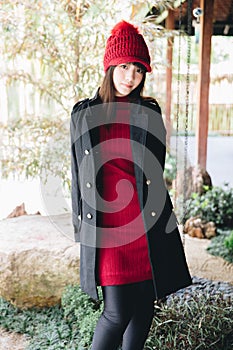 Portrait japanese fasion style wool coat fashion dress in japanese garden