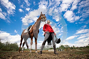 Portrait Jockey woman rider with brown horse, concept advertising equestrian club school