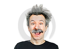 Portrait of jocular aging man with grey long hair smiling with open mouth, in Einstein manner. Isolated on background