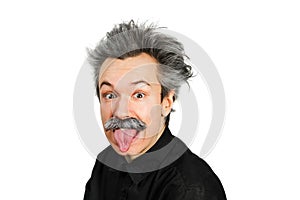 Portrait of jocular aging man with grey long hair sticking his tongue out in Einstein manner. Isolated on background