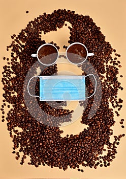 Portrait of John Lennon made of coffee beans and mugs with blue face protection mask