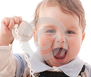 Portrait of joyful baby boy with pacifier