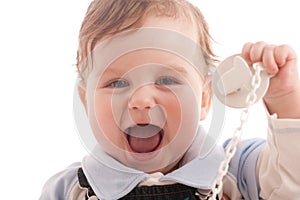 Portrait of joyful baby boy with pacifier