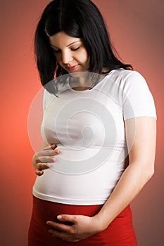 Portrait of joyful beautiful pregnant woman