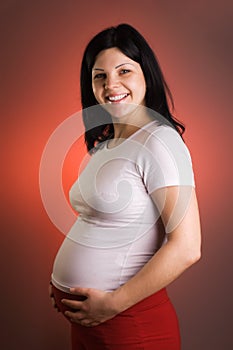 Portrait of joyful beautiful pregnant woman