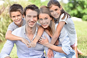 Portrait of joyful family outdoors