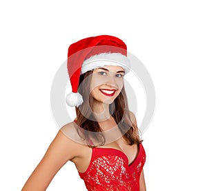 Portrait of joyful pretty girl in red christmas hat. emotional woman in red santa claus hat isolated on white background. Happy Ch