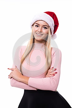 Portrait of joyful pretty woman in red santa claus hat isolated on white background. Beautiful girl looking happy and excited. Hap