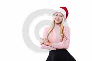 Portrait of joyful pretty woman in red santa claus hat isolated on white background. Beautiful girl looking happy and excited. Hap