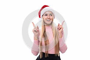 Portrait of joyful pretty woman in red santa claus hat isolated on white background. Beautiful girl looking happy and excited. Hap