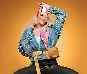 Portrait of joyful woman with colorful clothes and waist bag