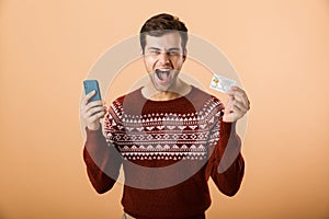 Portrait a joyful young man dressed in sweater