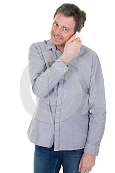 Portrait of joyful young man holding mobile phone