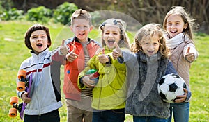 Portrait of junior school girls and boys playing