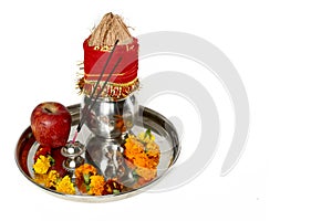 Portrait of kalash with coconut and pooja thali with apple for navratri festival