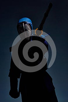 Portrait of a kendo fighter with shinai