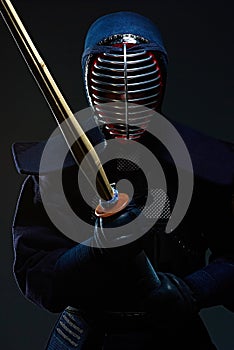 Portrait of a kendo fighter with shinai