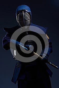 Portrait of a kendo fighter with shinai