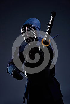 Portrait of a kendo fighter with shinai