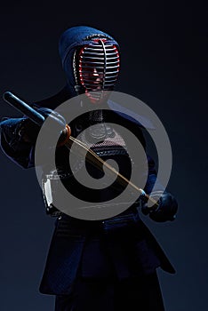 Portrait of a kendo fighter with shinai