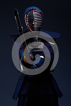 Portrait of a kendo fighter with shinai