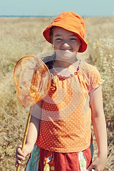 Portrait of kid girl with butterfly net